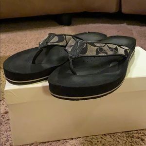 Black Coach Signature flip flop.